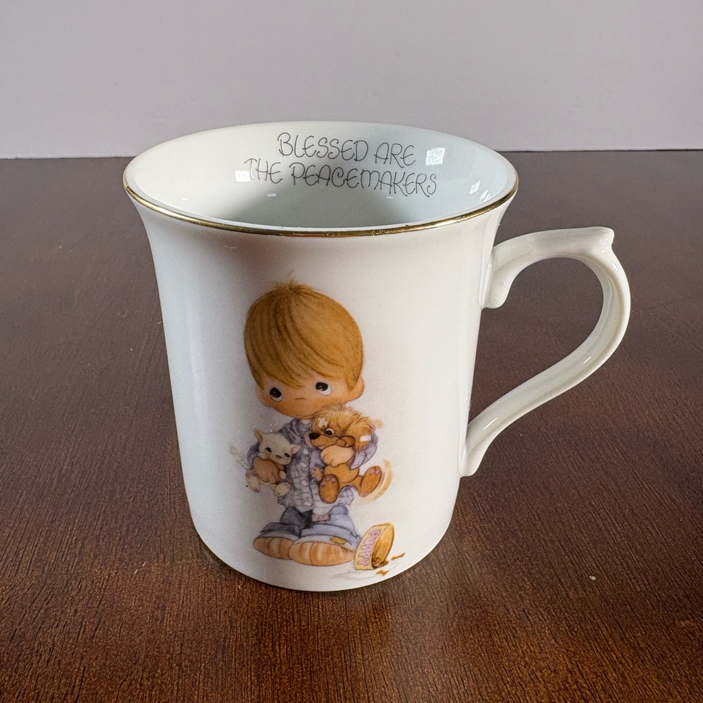 White vintage 1980 Precious Moments Mug with puppies.